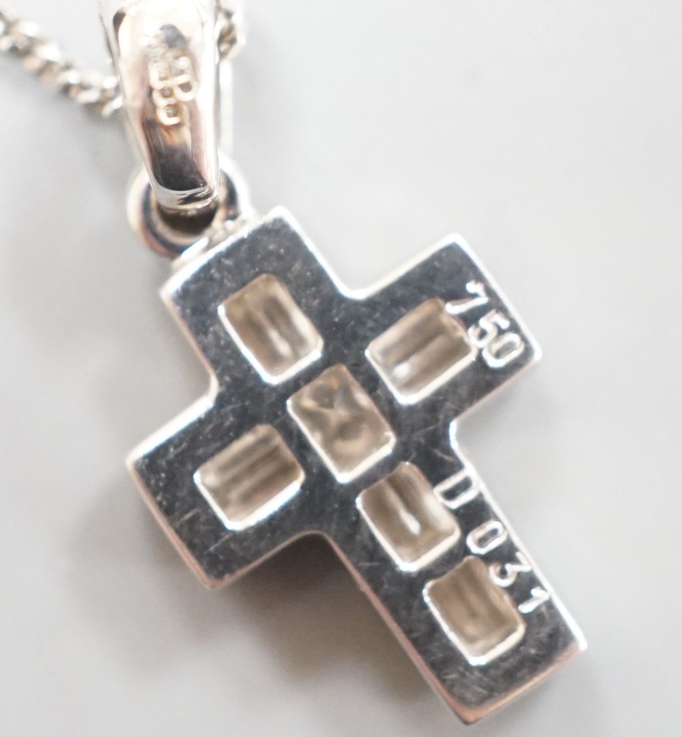 A modern 18ct white gold, baguette and princess cut diamond set cross pendant, 14mm, on an 18ct white gold fine link chain, 46cm, gross 3.8 grams
